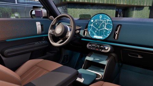 Innenraum eines modernen Autos mit Lenkrad und großem, rundem Display auf dem Armaturenbrett.